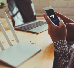 Someone connects a smartphone to a connected object