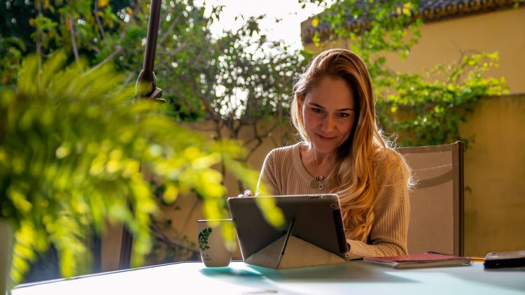 GettyImages - Nested - a woman watches a video on her tablet